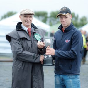 Tom Millicken presenting Kieran Killeen with a trophy for the overall Dairy category at the Mullagh Agricultural Show. Photo by Paul Corey.